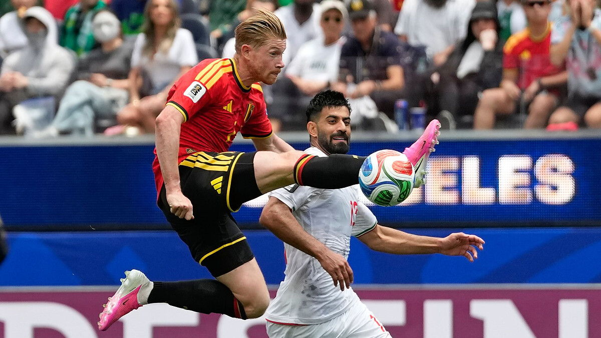 Iran go top of group with battling draw vs frustrated 10-man Belgium