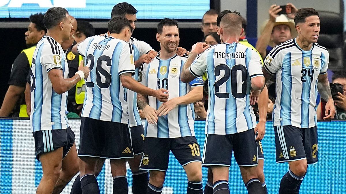 Messi makes scoring history with double to send Argentina through
