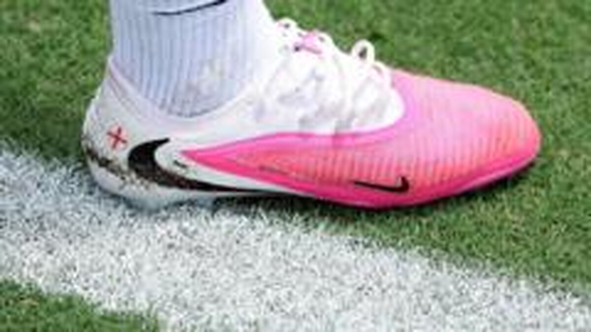 Why are footballers wearing pink boots at the World Cup?