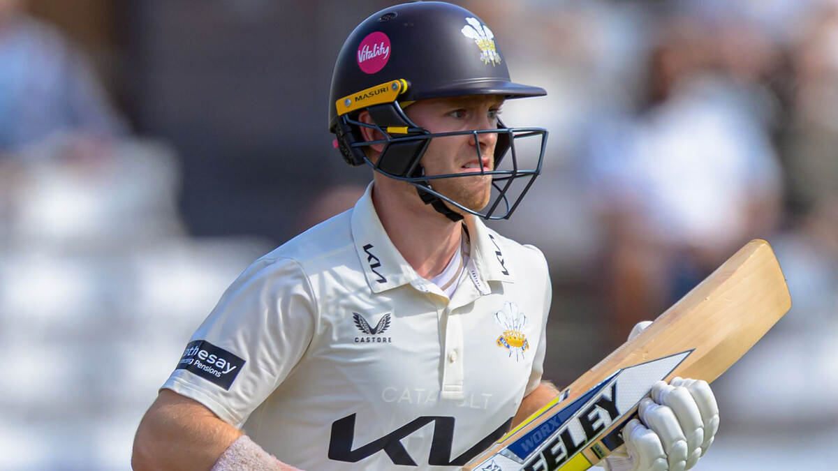 Surrey ease relegation fears with nerve-shredding win over Yorkshire